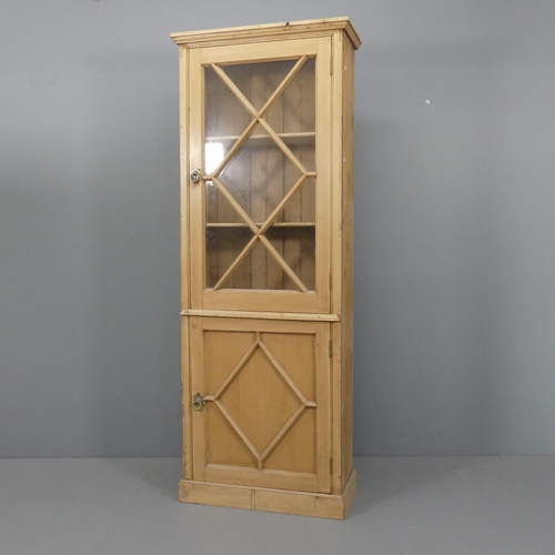 2104 - A vintage pine two-door bookcase. 78x205x34cm.