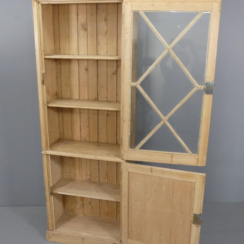 2104 - A vintage pine two-door bookcase. 78x205x34cm.