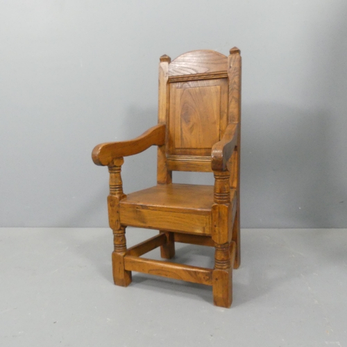 2107 - An early 20th century panelled oak child's chair of pegged construction. Overall 38x74x37cm, seat 28... 