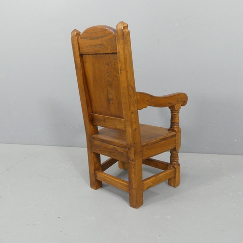 2107 - An early 20th century panelled oak child's chair of pegged construction. Overall 38x74x37cm, seat 28... 