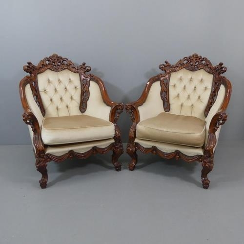 2109 - A Continental hardwood three piece suite, comprising a three-seater settee, 203x116x90cm and A pair ... 