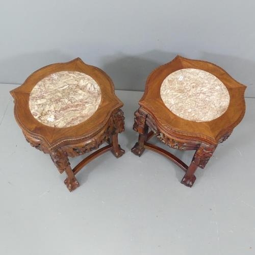 2110 - A pair of Chinese mahogany jardiniere stands, with inset marble tops, and carved and pierced decorat... 