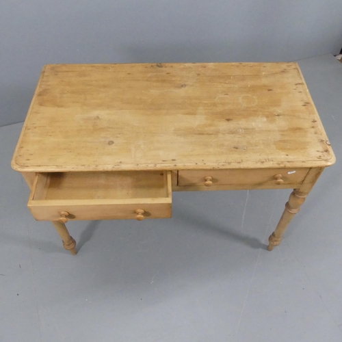 2115 - A vintage pine writing table, with two frieze drawers and raised on turned legs. 107x74x55cm.