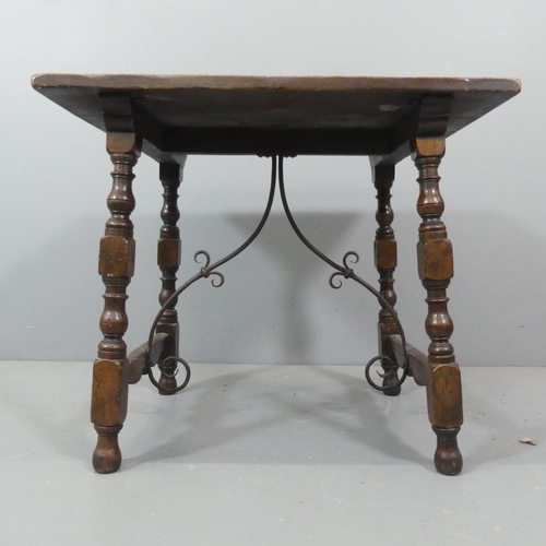 2217 - A 19th century Spanish table in oak with wrought iron stretchers. 72x61x55cm.