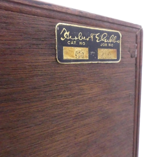 2190 - HERBERT GIBBS - A mid-century teak bookcase, with glass sliding doors and maker's label. 92x112x28cm... 