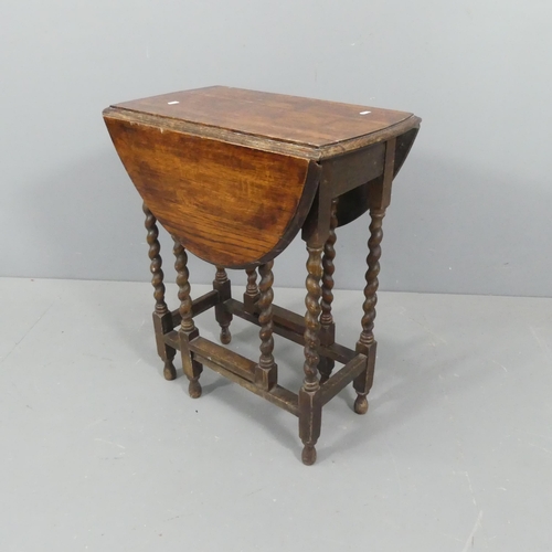 2191 - An early 20th century oak oval gate-leg table with barley twist supports. 60x72x36cm.