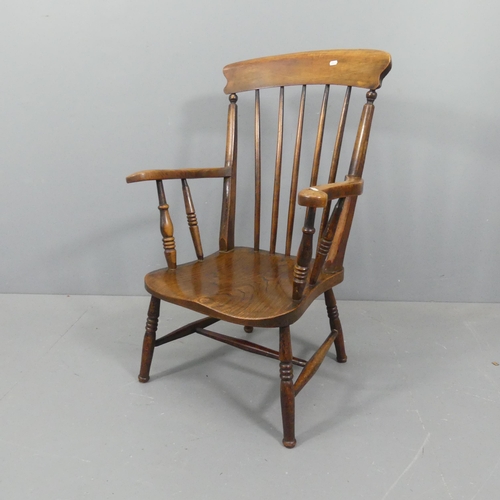 2192 - An elm-seated Windsor kitchen stick-back open armchair.