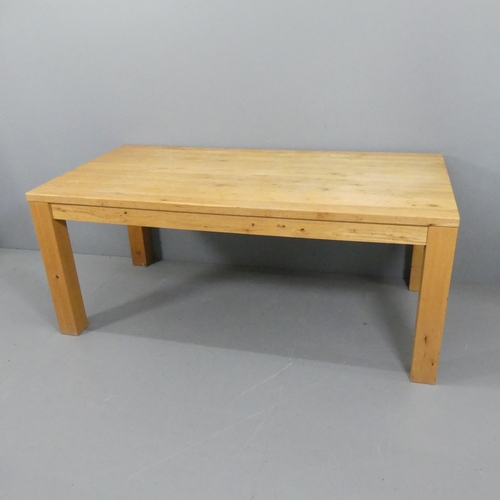 2194 - A modern light oak dining table. 180x75x90cm.