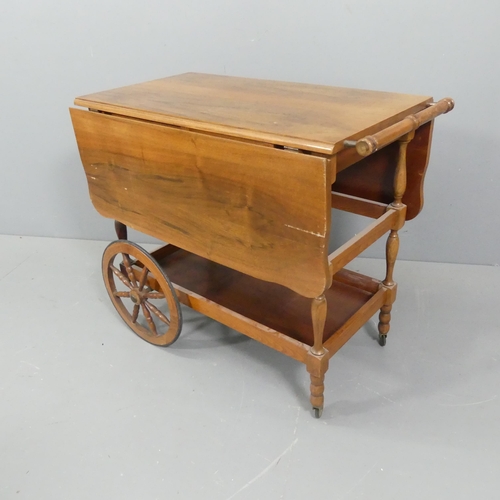 2200 - A mid-century teak two-tier drink's trolley / bar cart. 83x72x47cm, opening to 102cm.