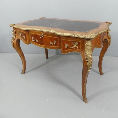 2201 - A French Louis XVI style writing desk, with tooled and embossed leather skiver, brass mounts, three ... 