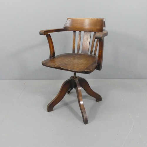 2218 - An early 20th century oak swivel desk chair.