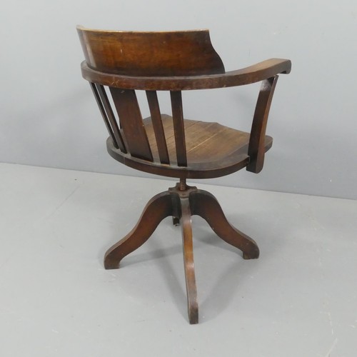 2218 - An early 20th century oak swivel desk chair.