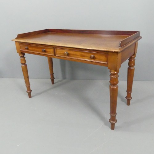 2216 - A Victorian mahogany writing table, with raised back, two drawers and raised on turned legs. 121x78x... 