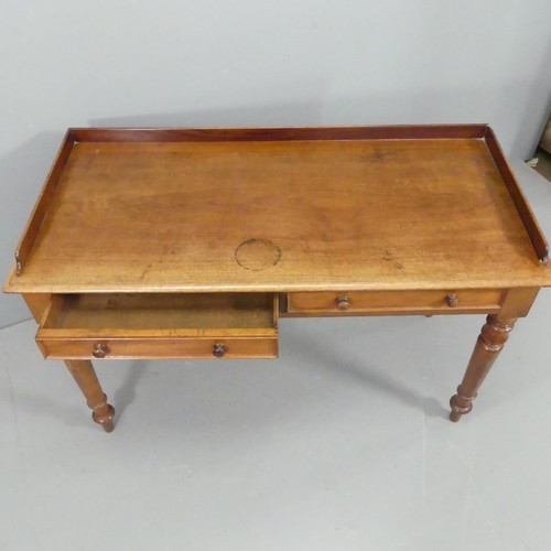 2216 - A Victorian mahogany writing table, with raised back, two drawers and raised on turned legs. 121x78x... 