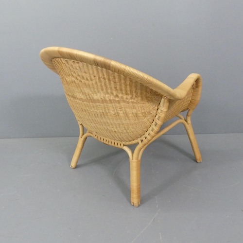 2096 - NANA DITZEL - A mid-century Danish rattan lounge chair , Madame by Sika Design, Denmark, designed in... 