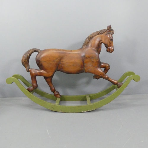 TREVOR WIFFEN - A large craftsman-made pine rocking horse, with carved mane and tail. Overall 187x120x45cm.