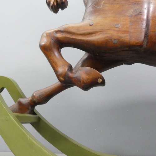 2099 - TREVOR WIFFEN - A large craftsman-made pine rocking horse, with carved mane and tail. Overall 187x12... 