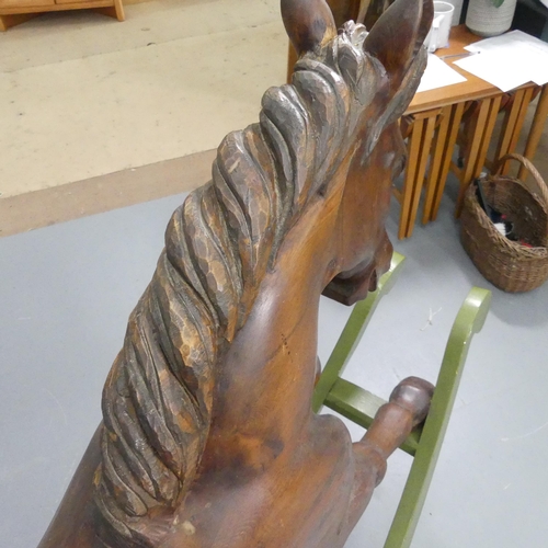 2099 - TREVOR WIFFEN - A large craftsman-made pine rocking horse, with carved mane and tail. Overall 187x12... 