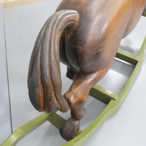 2099 - TREVOR WIFFEN - A large craftsman-made pine rocking horse, with carved mane and tail. Overall 187x12... 