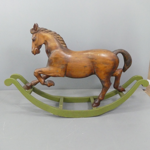 2099 - TREVOR WIFFEN - A large craftsman-made pine rocking horse, with carved mane and tail. Overall 187x12... 