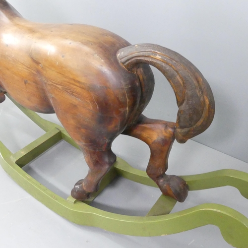 2099 - TREVOR WIFFEN - A large craftsman-made pine rocking horse, with carved mane and tail. Overall 187x12... 