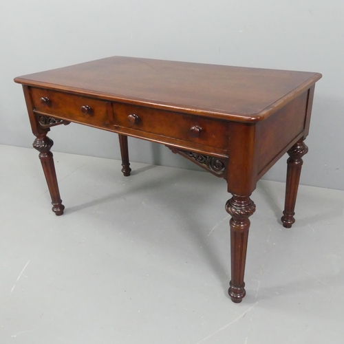 2223 - Heal & Son - a Victorian mahogany writing table, with two frieze drawers and carved and pierced deco... 