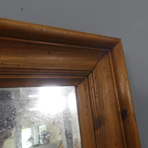 2268 - A modern pine-framed rectangular wall mirror. 52x144cm.