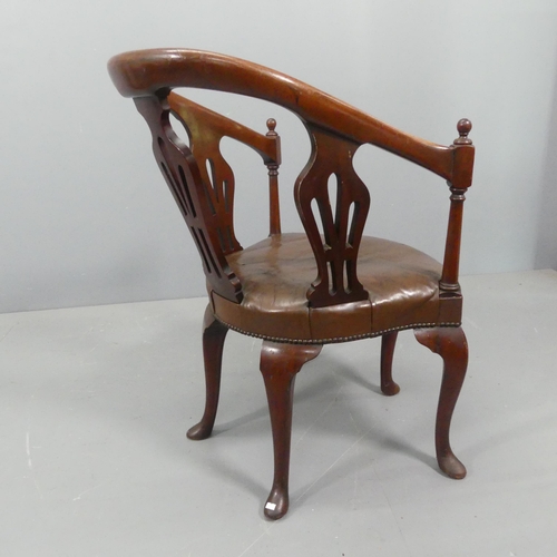 2221 - A George II style armchair with pierced splats above leather seat, on five legs with pad feet.