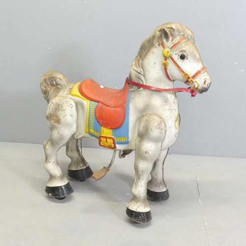 2502 - A vintage tinplate ride-on horse toy. 69x77x35cm.