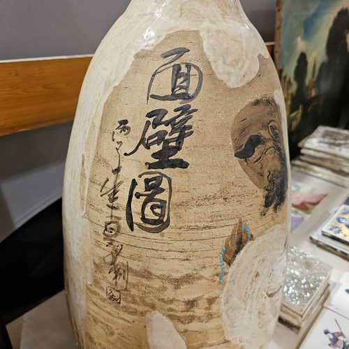 348 - A large Chinese pottery vase with painted text and figure, height 58cm