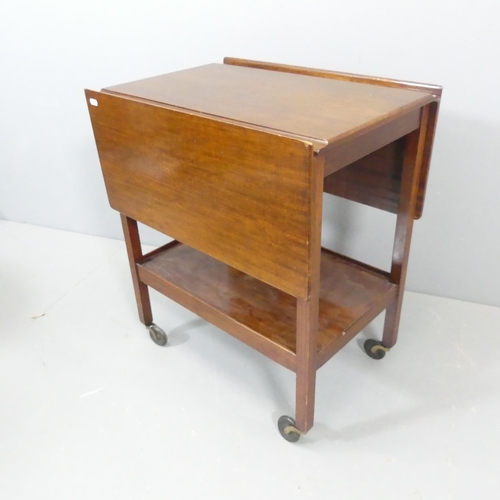 2532 - A 1930s oak two-tier tea trolley, with drop leaves and Bakelite casters. 61x72x43cm.