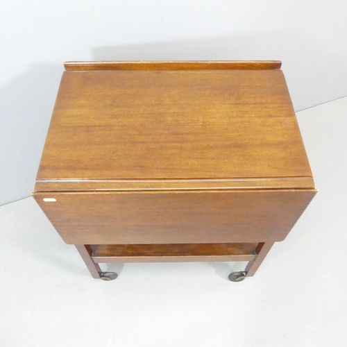 2532 - A 1930s oak two-tier tea trolley, with drop leaves and Bakelite casters. 61x72x43cm.