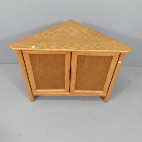 2555 - A mid-century teak corner cupboard. 85x77x47cm.