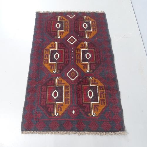 2287 - A red ground Baluchi rug, 140x86cm.