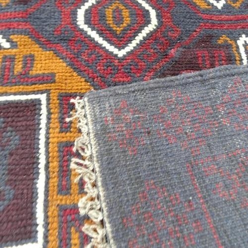 2287 - A red ground Baluchi rug, 140x86cm.