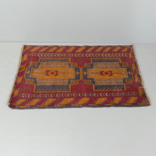 2288 - A red-ground Afghan rug. 138x89cm.