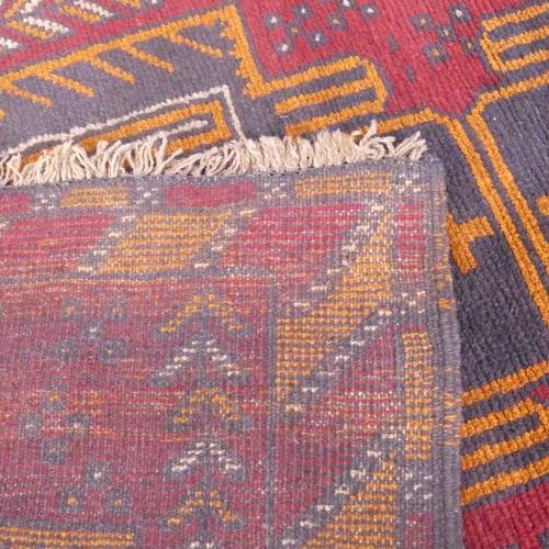 2288 - A red-ground Afghan rug. 138x89cm.