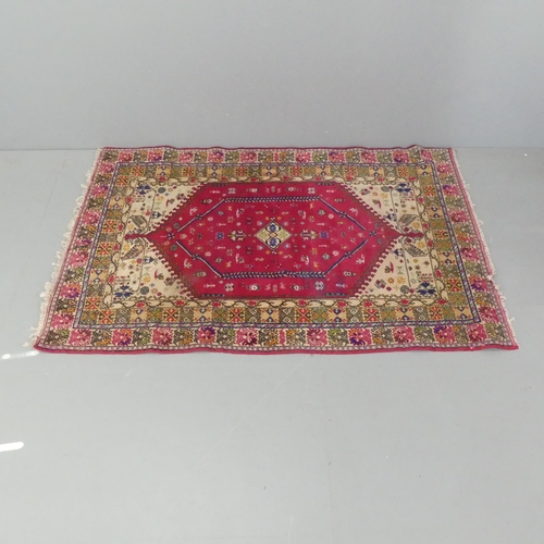 2291 - A red and cream-ground Turkish rug. 180x120cm.