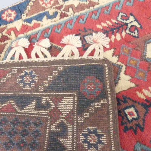 2292 - A red-ground Caucasian rug. 178x78cm.