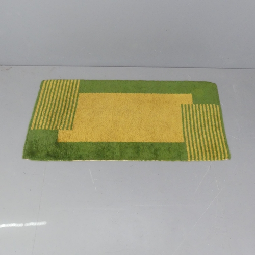 2293 - A green and yellow-ground Art Deco style rug. 153x75cm.