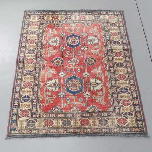 2297 - A red and cream-ground Kirman rug. 160x121cm.