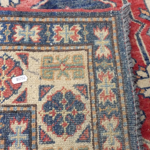 2297 - A red and cream-ground Kirman rug. 160x121cm.