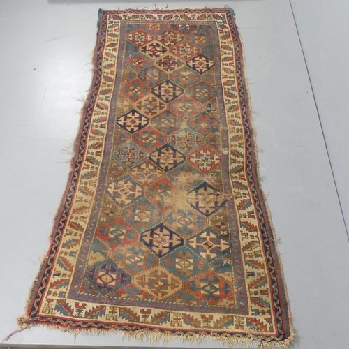 2307 - A cream and blue-ground Kazakh rug. 265x120cm.