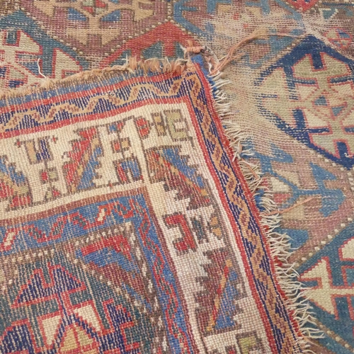 2307 - A cream and blue-ground Kazakh rug. 265x120cm.