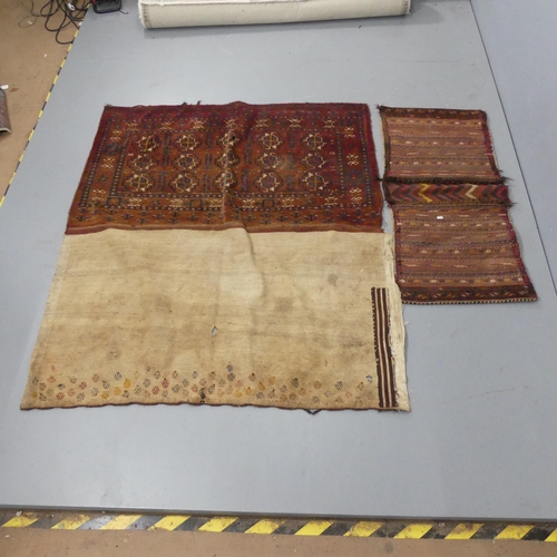 2310 - An Afghan twin saddle bag, 188x55cm, and an Afghan rug. (2)