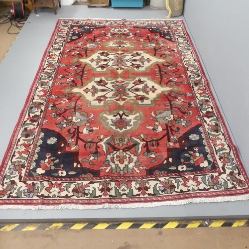 2321 - A red-ground Bakhtiari carpet. 300x195cm.