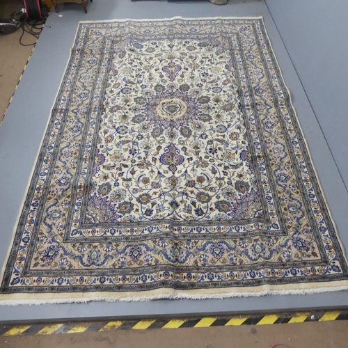 2322 - A Cream-ground Kashmiri carpet. 300x190cm.