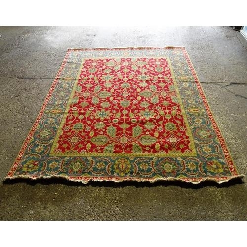 2325 - A red and green ground Persian design carpet, 370x276cm