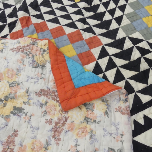 2327 - A patchwork quilt with geometric designs. 217x217cm.