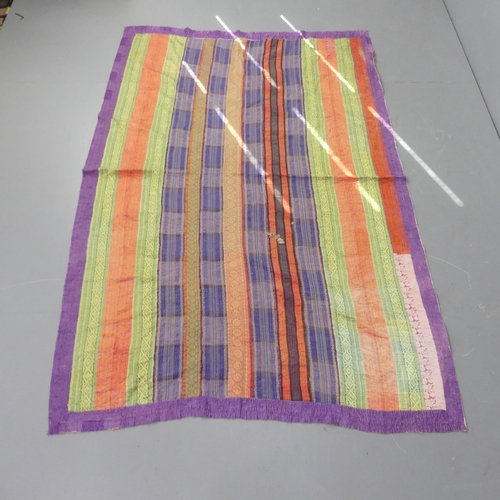 2328 - A modern multi-coloured striped rag rug. 205x132cm.